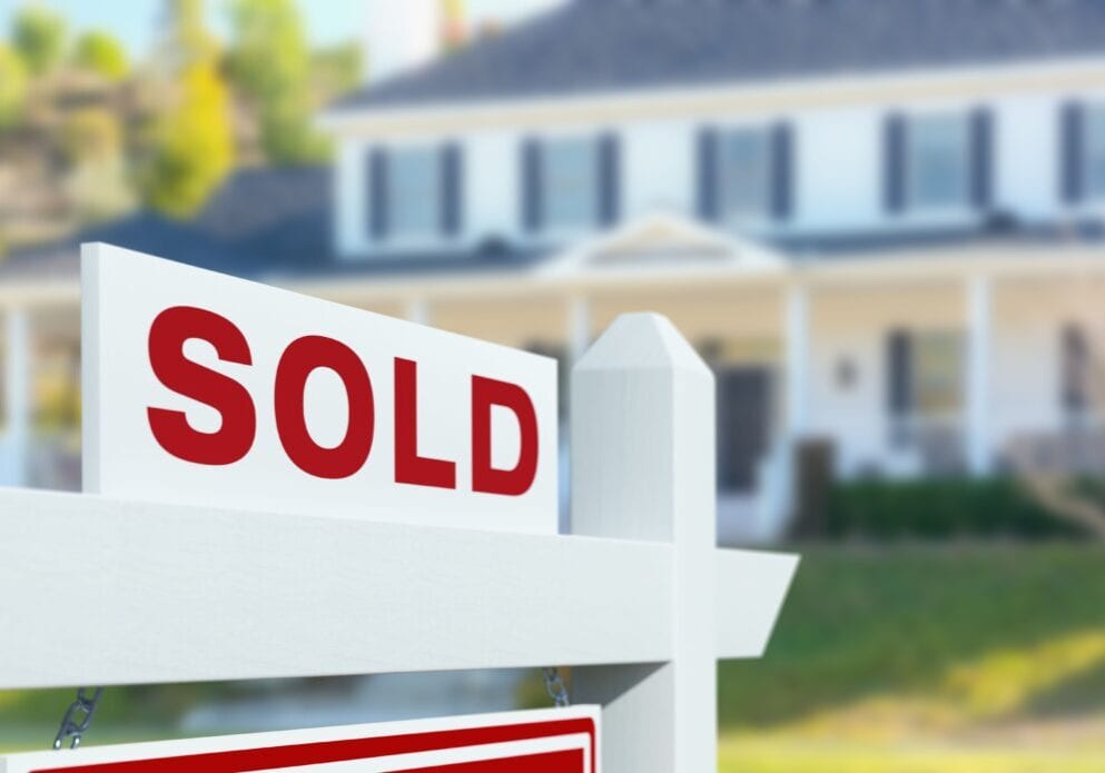 sold-for-sale-real-estate-sign-in-front-of-new-royalty-free-image-1685982441 (1)