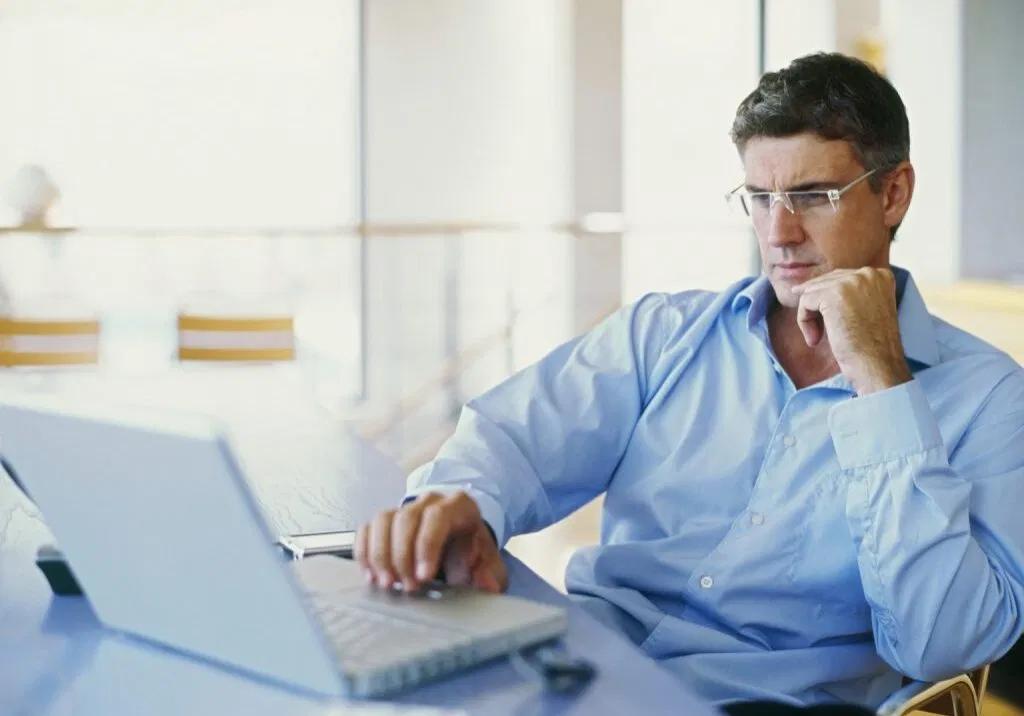 businessman using a laptop in an office