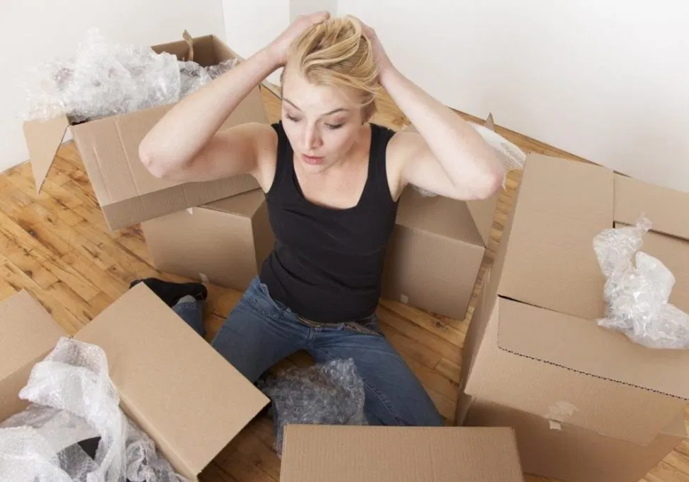 Caucasian woman unpacking boxes in new home